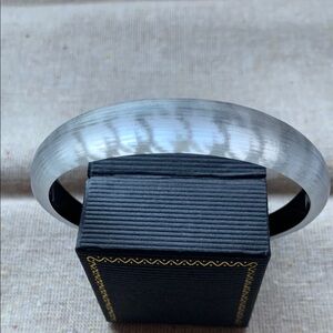 Alexis Bittar tapered bangle bracelet.